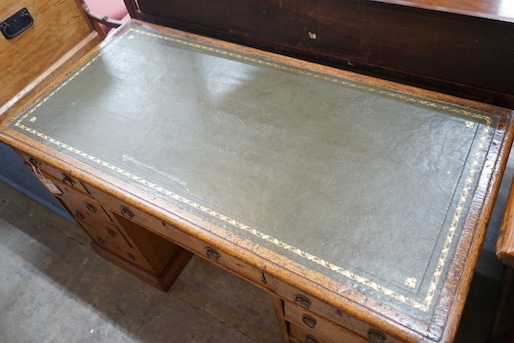 A Victorian light oak pedestal desk, fitted nine small drawers, width 120cm, depth 59cm, height 72cm